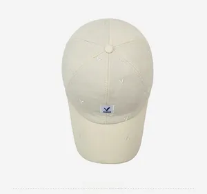 Top view of beige quilted baseball cap showing diamond stitch texture and fabric patch