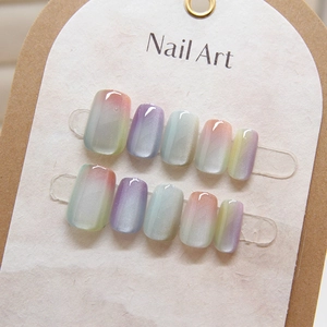 Cat eye press-on nails with multi-color gradient shimmer effect and high gloss finish