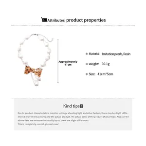 Detail view of pearl bow necklace with dimensions 41cm length and 30.1g weight specs