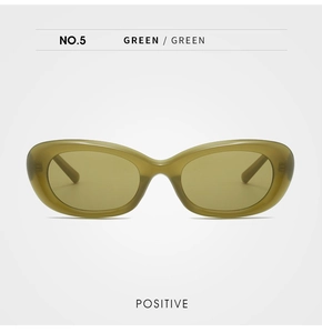Front view of oval cat-eye sunglasses in transparent olive green with tinted lenses