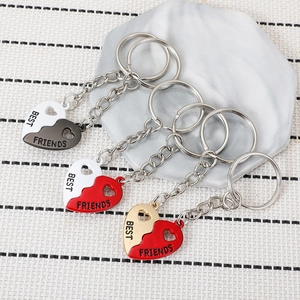 Three magnetic heart Best Friends keychains in black, red and gold metal for friendship gifts