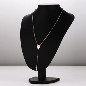 Silver and gold rosary bead necklace with religious portrait medallion and cross