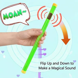 Luminous fluorescent green groan tube toy for kids that makes magical sounds when flipped