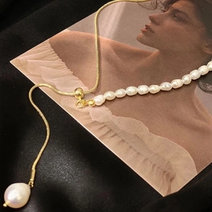 Golden snake chain necklace with white freshwater pearls and baroque pearl pendant