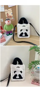 Detail of plush panda handbag with Angry PANDA embroidery and soft faux fur texture