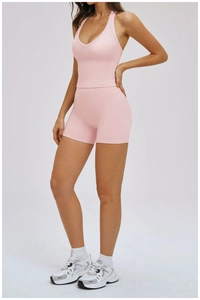 Close-up of pink yoga set fabric showing high-stretch material and professional stitching