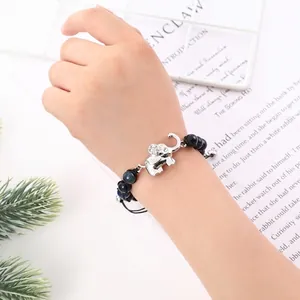 Handmade woven elephant charm bracelet with 8mm black volcanic lava and tiger eye stones