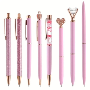 Detail of eight assorted pink and rose gold crown pens with glitter and crystal charms