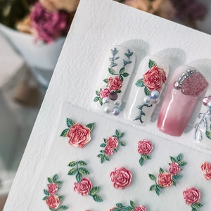 3D embossed floral nail stickers featuring red roses and green leaves on white nails