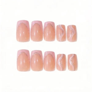 Detail of pink French manicured press-on nails with silver glitter and wavy line accents