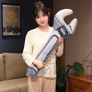 Creative wrench plush pillow held by a model, grey novelty tool decorative cushion