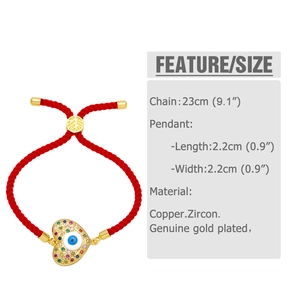 Detail view of red rope bracelet with gold-plated heart evil eye pendant and size specs
