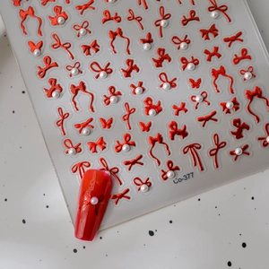3D red bow nail art stickers with white pearls and metallic gold finish Co-377