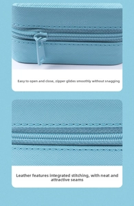 Detail of light blue PU leather jewelry box showing smooth zipper and fine stitching