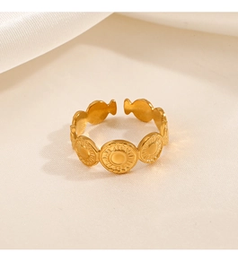 Detailed view of adjustable gold-plated geometric circle rings on soft textured fabric