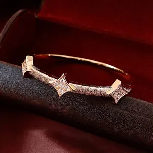 Elegant 18K rose gold plated starburst cuff bracelet with cubic zirconia and matte texture