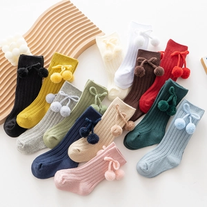 Baby knee-high ribbed socks with pom-poms and bows in thirteen assorted colors