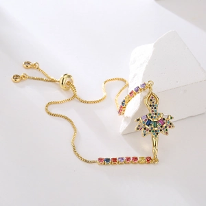 Detail of gold-plated ballerina charm bracelet with colorful cubic zirconia stones