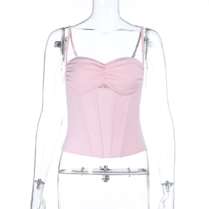 Detailed view of pink corset camisole featuring decorative boning on a mannequin