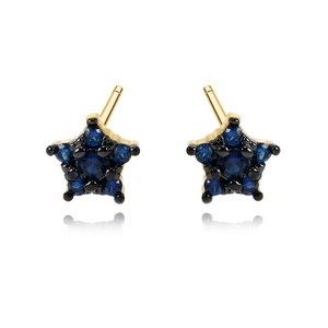 Star-shaped earrings with blue zircon stones and gold finish on a white background