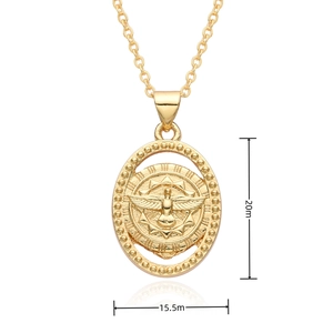 Detailed view of gold oval pendant with bird relief measuring 20mm by 15.5mm