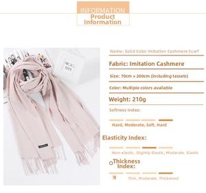 Detail of pink faux cashmere scarf showing 70x200cm size and soft tassel texture