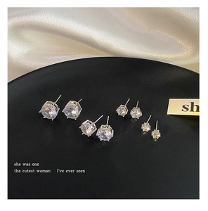 Detail view of four pairs of round cubic zirconia stud earrings in varying sizes