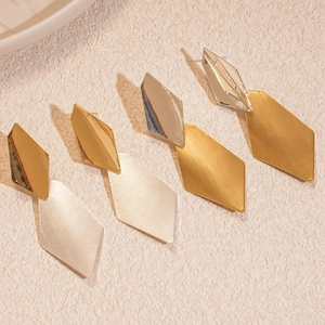 Modern geometric rhombus drop earrings with gold and silver brushed metal finish