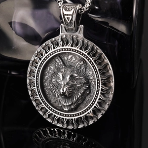 Macro shot of a Viking wolf head round medallion with radial sunburst texture