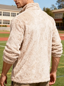 Detail of soft beige polar fleece jacket with half-zip stand collar and warm texture