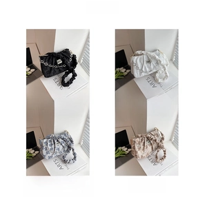 Detail showing pleated shoulder straps and metal chains in four colors including floral prints