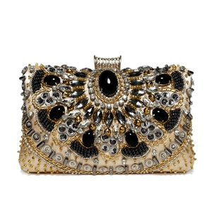 Luxury beaded evening clutch bag with champagne gold base and sparkling crystals