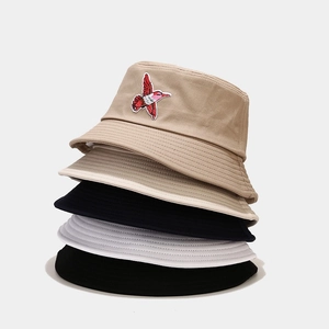 Five assorted bucket hats with hummingbird embroidery for sun protection and outdoor casual wear
