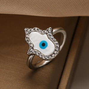 Silver Hamsa Hand ring with mother of pearl inlay and blue Evil Eye zircon accents