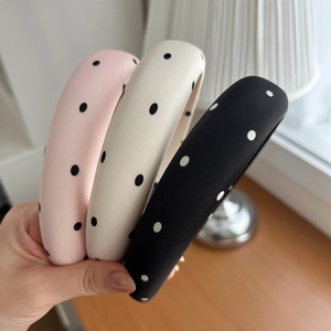 Set of three padded polka dot satin headbands in pink, beige and black colors