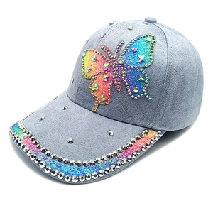 Blue suede baseball cap with rhinestone butterfly and silver stud accents