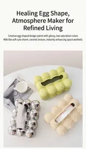 Top view of creative marshmallow ceramic tissue boxes in green, silver, and beige colors