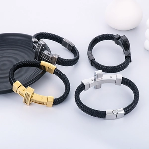 Detail of men's braided leather bracelets with stainless steel magnetic cross clasps