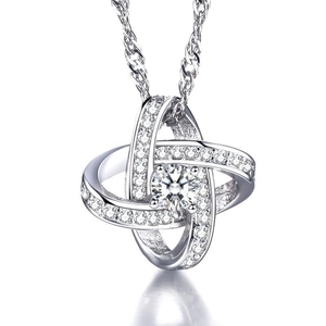 Detail of interlocking silver rings with a large round diamond-cut centerpiece stone