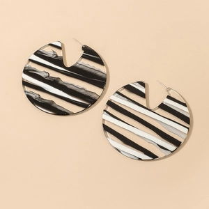 Chic black and white striped acrylic hoop earrings with a glossy geometric finish