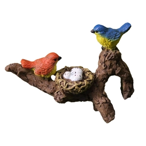 Garden bird resin figurine with colorful birds and eggs on wood branch base for planter