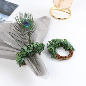 Rustic woven leaf napkin ring made of natural vine and artificial green foliage