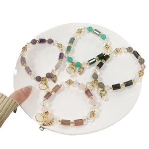 Pastel crystal bead bracelets with starfish charms in purple, green, and pink colors