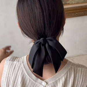 Elegant large black satin bow hair clip for women's low bun hairstyle hair accessory