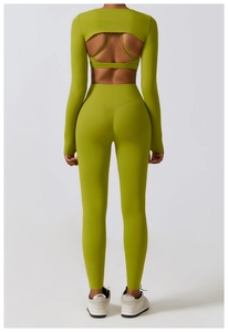 Detailed back view of olive green yoga set featuring large cutout design and high-waist fit