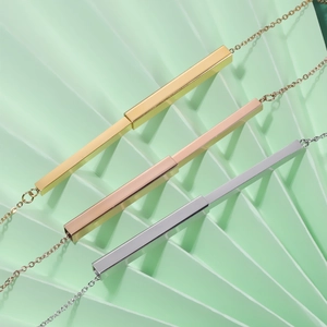 Detailed view of adjustable bar pendants in gold, rose gold, and silver stainless steel