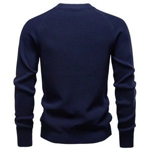 Rear view of dark blue crew neck knitted sweater showing high-quality fabric texture
