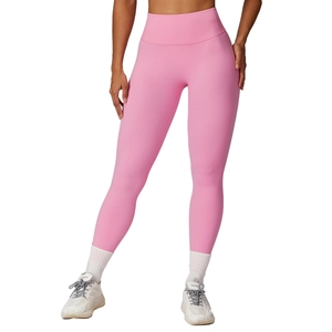 Pink high-waisted compression yoga leggings with a seamless waistband for tummy control
