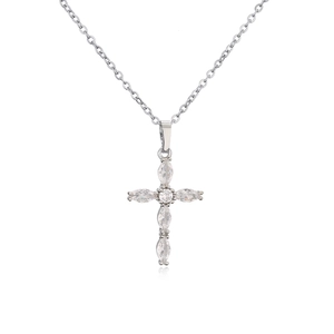Macro shot of micro-paved marquise zircon cross pendant on a silver link chain