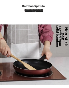 Action shot of using long handle bamboo spatula for stir-frying in a non-stick pan